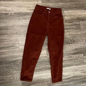 High waisted rust corduroy Levi tapered pants